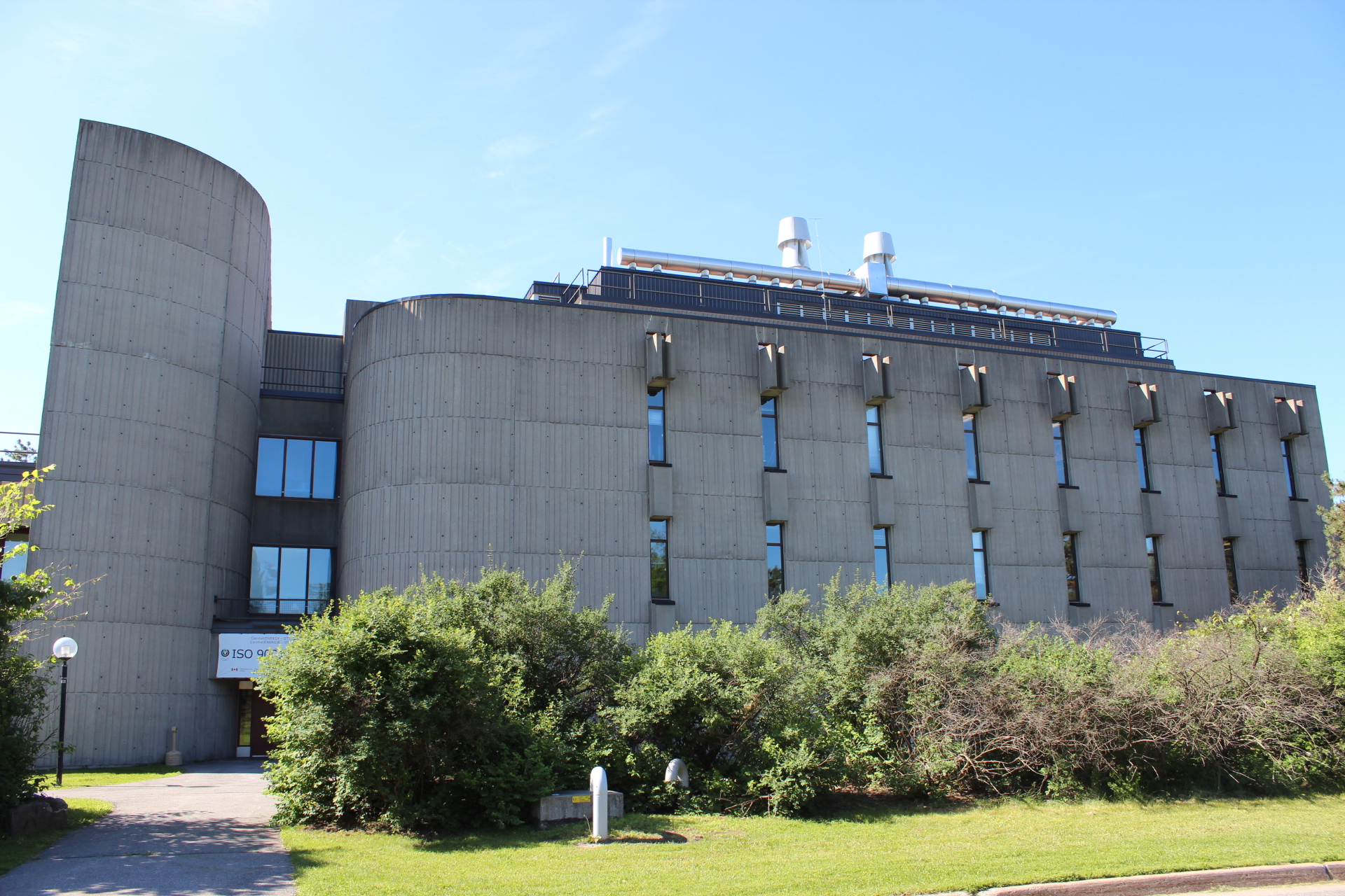 Brutalist concrete building against a blue sky